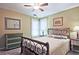 Bedroom with lots of light, features a bed with wood headboard and a painted dresser at 4246 Loch Highland Ne Pkwy, Roswell, GA 30075
