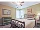 Bedroom with decorative bed frame, green dresser, and large bright window at 4246 Loch Highland Ne Pkwy, Roswell, GA 30075