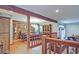 Open-concept dining room with wood floors and exposed beams at 4246 Loch Highland Ne Pkwy, Roswell, GA 30075