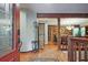 Inviting entryway with hardwood floors and wood accent walls leading into the home at 4246 Loch Highland Ne Pkwy, Roswell, GA 30075