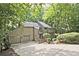Traditional-style home featuring an attached two-car garage and ample driveway space at 4246 Loch Highland Ne Pkwy, Roswell, GA 30075