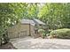 Traditional home with a two-car garage and mature landscaping at 4246 Loch Highland Ne Pkwy, Roswell, GA 30075