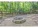 Charming firepit area in the backyard, perfect for gatherings at 4246 Loch Highland Ne Pkwy, Roswell, GA 30075