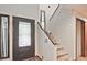 Bright foyer with stairs leading to the second floor at 4246 Loch Highland Ne Pkwy, Roswell, GA 30075