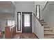 Foyer with hardwood floors and staircase at 4246 Loch Highland Ne Pkwy, Roswell, GA 30075