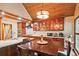 Kitchen with wood ceiling, cherry-wood cabinets, bar counter-top, and stainless-steel microwave and coffee machine at 4246 Loch Highland Ne Pkwy, Roswell, GA 30075