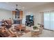 Bright and airy living room featuring a fireplace, large TV, and comfortable seating arrangement at 4246 Loch Highland Ne Pkwy, Roswell, GA 30075