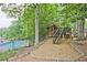 Charming wooden playground structure with a slide and stairs, next to a refreshing pool area at 4246 Loch Highland Ne Pkwy, Roswell, GA 30075