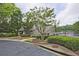 Charming pool house with landscaped garden and a view of the lake, creating a serene atmosphere at 4246 Loch Highland Ne Pkwy, Roswell, GA 30075