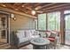 Inviting screened porch with comfortable seating and a cozy ambiance at 4246 Loch Highland Ne Pkwy, Roswell, GA 30075
