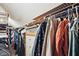 Walk-in closet featuring adjustable shelving and hanging rods, providing ample storage space for clothing and accessories at 4246 Loch Highland Ne Pkwy, Roswell, GA 30075