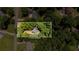 Aerial view shows a wooded lot with mature trees, offering privacy and a serene setting on +/- 0.43 acres at 5340 Young Deer Dr, Cumming, GA 30041