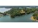 Aerial view of lakefront property with lush greenery and docks on the water highlighting the lakefront lifestyle at 5340 Young Deer Dr, Cumming, GA 30041