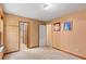 A well-lit bedroom showing an ensuite bathroom with neutral walls and two framed pictures on the wall at 5340 Young Deer Dr, Cumming, GA 30041