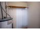 A storage area is shown with a water heater and a wooden shelf with a metal bracket at 5340 Young Deer Dr, Cumming, GA 30041