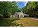 Charming one-story home with a well-maintained lawn and mature trees surrounding the property at 5340 Young Deer Dr, Cumming, GA 30041