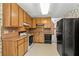 Well-equipped kitchen featuring a range of appliances, light-colored cabinets, and functional layout at 5340 Young Deer Dr, Cumming, GA 30041