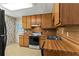 Functional kitchen featuring light-colored cabinets, laminate countertops, and standard appliances at 5340 Young Deer Dr, Cumming, GA 30041