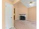Cozy living room with fireplace, high ceiling, and access to kitchen at 5340 Young Deer Dr, Cumming, GA 30041
