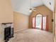 Inviting living room with fireplace, large window with curtains, and neutral carpeting at 5340 Young Deer Dr, Cumming, GA 30041