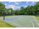 Full basketball court on outdoor sports area surrounded by trees at 5655 Stevehaven Ln, Cumming, GA 30028