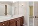 Vanity area features dual doors to closets, solid surface counters and plenty of room to get ready at 5655 Stevehaven Ln, Cumming, GA 30028
