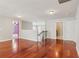 Bonus room with wood flooring, stairway with wood handrail, and two open entryways at 5655 Stevehaven Ln, Cumming, GA 30028