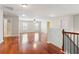 Bright bonus room featuring wood floors, ceiling fan, and access to bedrooms and bathroom at 5655 Stevehaven Ln, Cumming, GA 30028