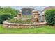 Elegant stone entrance sign for Wild Meadows, surrounded by landscaping at 5655 Stevehaven Ln, Cumming, GA 30028
