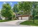 Charming two-story home with a well-manicured front yard and a two-car garage at 5655 Stevehaven Ln, Cumming, GA 30028