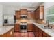 Open kitchen featuring granite countertops, stainless steel appliances, and modern fixtures at 5655 Stevehaven Ln, Cumming, GA 30028