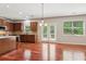Kitchen with stainless steel appliances, granite countertops, a center island, and access to the patio at 5655 Stevehaven Ln, Cumming, GA 30028