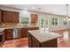 Open kitchen featuring granite countertops, stainless steel appliances, and ample cabinet space at 5655 Stevehaven Ln, Cumming, GA 30028