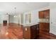 Kitchen with island, open to living room, featuring granite countertops and cabinet space at 5655 Stevehaven Ln, Cumming, GA 30028