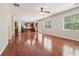 Open living room with hardwood floors and lots of natural light, seamlessly connected to the kitchen at 5655 Stevehaven Ln, Cumming, GA 30028