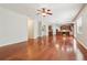 Spacious living room featuring beautiful hardwood floors and an open floor plan at 5655 Stevehaven Ln, Cumming, GA 30028