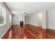 Bright living room featuring hardwood floors, large windows, and a fireplace at 5655 Stevehaven Ln, Cumming, GA 30028