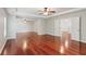 Expansive main bedroom with tray ceiling, wood floors, and access to multiple rooms at 5655 Stevehaven Ln, Cumming, GA 30028