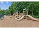 Community playground featuring slides, climbing structures, and seating at 5655 Stevehaven Ln, Cumming, GA 30028