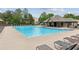 Large community swimming pool surrounded by lounge chairs at 5655 Stevehaven Ln, Cumming, GA 30028