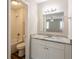 Bright bathroom with granite countertops, white cabinetry, and a shower-tub combination at 225 Fireside Way, Fairburn, GA 30213