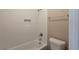 Updated bathroom featuring tiled walls and tub-shower combination, creating a clean aesthetic at 225 Fireside Way, Fairburn, GA 30213