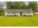 Charming single-story home featuring a well-manicured lawn and neutral exterior paint at 225 Fireside Way, Fairburn, GA 30213