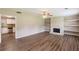 Open living room with fireplace and view into a well-appointed kitchen at 225 Fireside Way, Fairburn, GA 30213