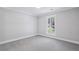 Cozy bedroom with carpet and a large window at 255 Broken Lance Pl, Johns Creek, GA 30022