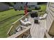 Outdoor deck with seating, grill, and fire pit at 255 Broken Lance Pl, Johns Creek, GA 30022