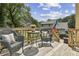 Relaxing outdoor deck with wicker furniture, ideal for entertaining with neighborhood views at 255 Broken Lance Pl, Johns Creek, GA 30022