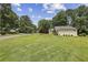Well-maintained front yard featuring a lush lawn and inviting landscaping surrounding the charming home at 255 Broken Lance Pl, Johns Creek, GA 30022