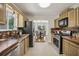 The updated kitchen is equipped with stainless steel appliances and tile backsplash at 255 Broken Lance Pl, Johns Creek, GA 30022