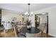 Open concept featuring a living room open to dining area and kitchen at 255 Broken Lance Pl, Johns Creek, GA 30022